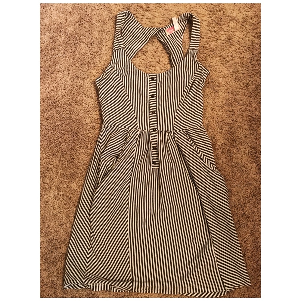 White and gray striped dress with open back.